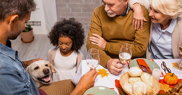 Dog at Thanksgiving Table with Family